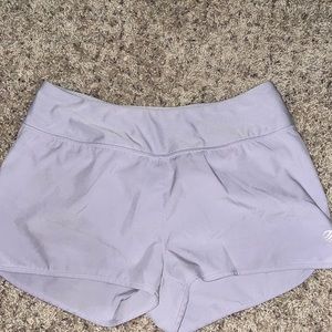 Purple athletic shorts with zipper pocket